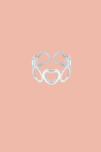 Stainless steel ring with open hearts